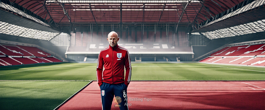 Lee Carsley in training, leading the England team with a tracksuit during Nations League preparations.